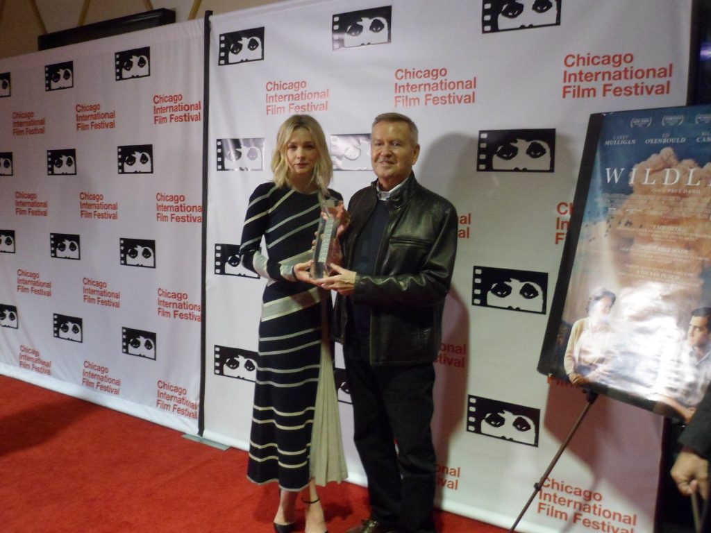 Carey Mulligan is presented with the Artistic Achievement Award by Michael Kutzla at the 54th Chicago International Film Festival.