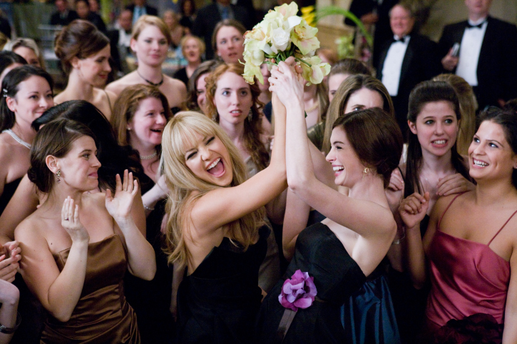 Liv (Kate Hudson, left) and Emma (Anne Hathaway) delight in catching the bouquet at a friend's wedding in Bride Wars.