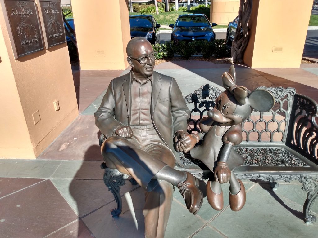 A statue of Roy Disney and Minnie Mouse.