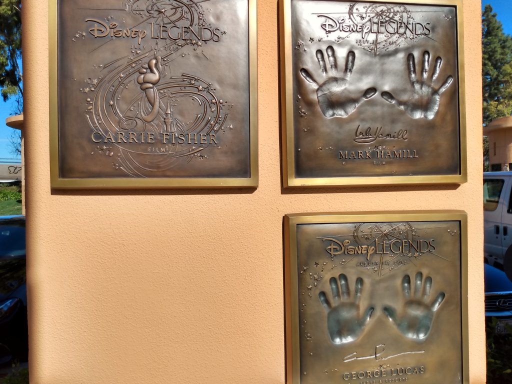 The Disney Legends plaques of Carrie Fisher, Mark Hamill, and George Lucas.