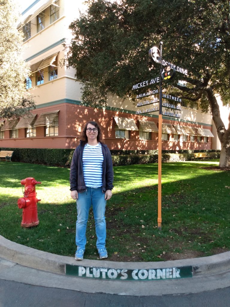 Danielle Solzman poses along Pluto's Corner at Mickey Avenue and Dopey Lane.