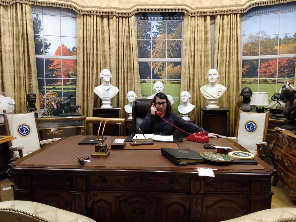 Danielle Solzman speaking on the phone in the Oval Office.