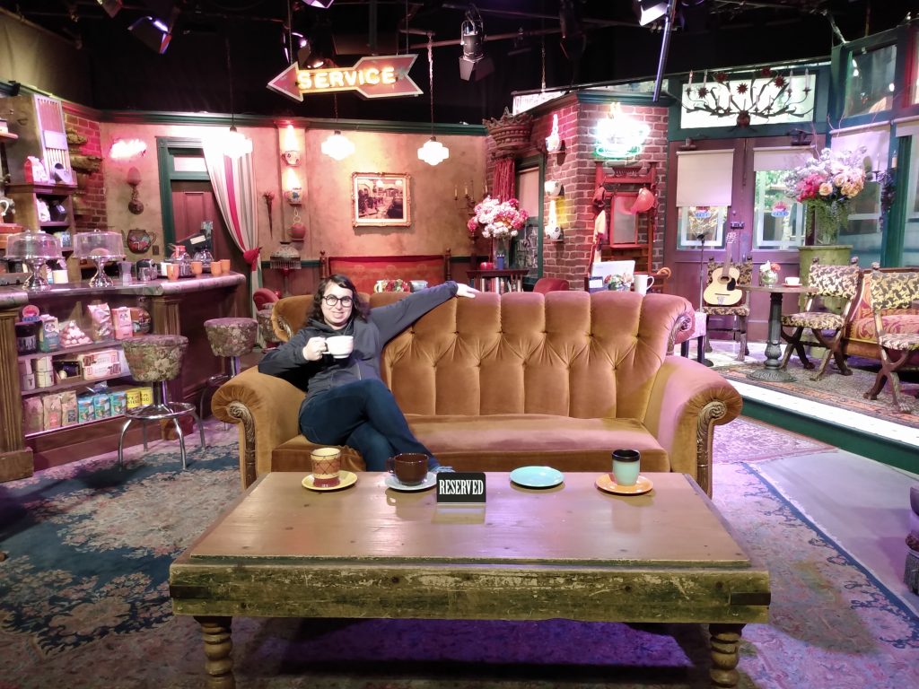 Danielle Solzman sits in the Central Perk set.