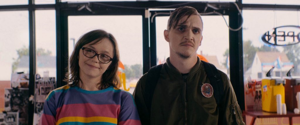 Emily Skeggs and Kyle Gallner appear in Dinner in America.