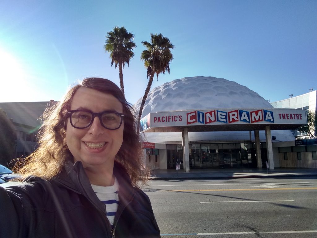 Danielle Solzman poses in front of the Cinerama Dome.