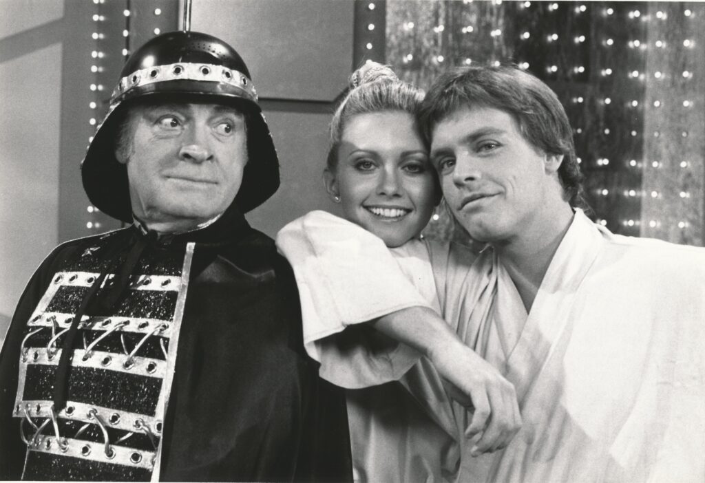 Bob Hope (left), Olivia Newton John (center), and Mark Hamill (right)