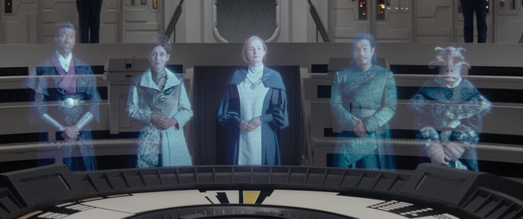 Senator Mawood (Maurice Irvin), Senator Rodrigo (Jacqueline Antaramian), Chancellor Mon Mothma (Genevieve O'Reilly), Senator Xiono (Nelson Lee) and Gran Senator (Erica Duke) in Star Wars: Ahsoka.