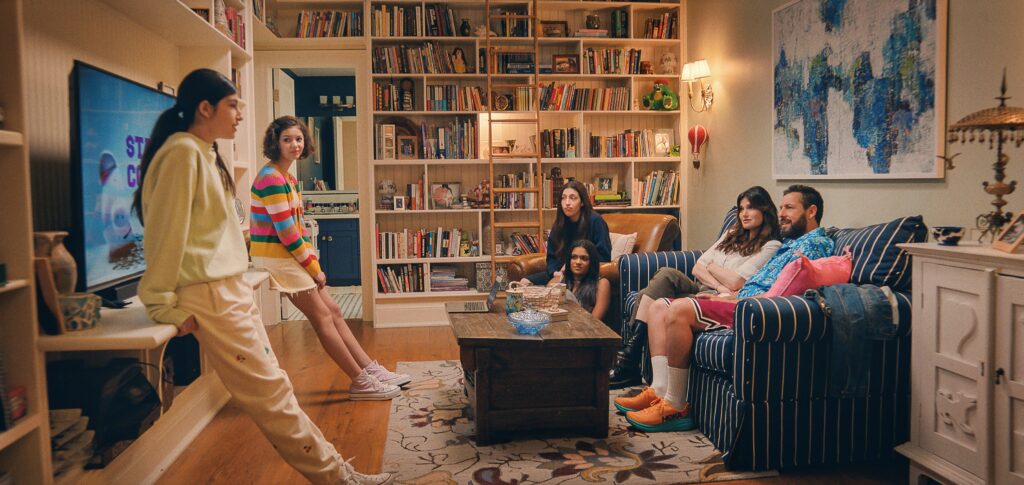 (L to R ) Sunny Sandler as Stacy Friedman, Samantha Lorraine as Lydia Rodriguez Katz, Sadie Sandler as Ronnie Friedman, Zaara Kuttemperoor as Zaara, Idina Menzel as Bree Friedman and Adam Sandler as Danny Friedman in You Are So Not Invited To My Bat Mitzvah.