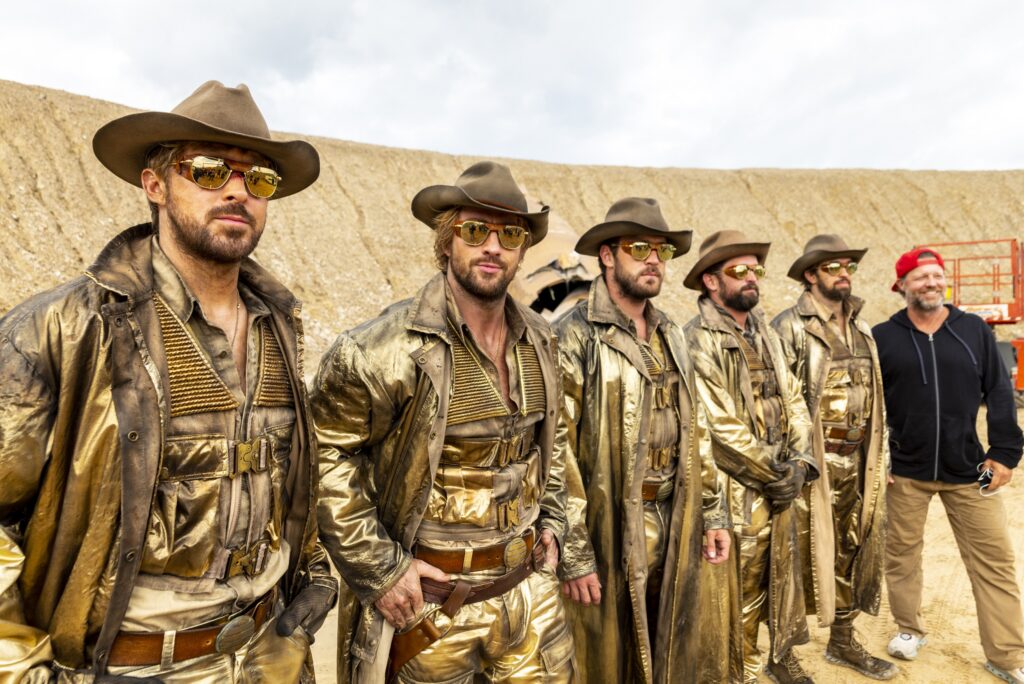 L to R: Ryan Gosling, Aaron Taylor-Johnson, Ben Jenkin, Logan Holladay, Justin Eaton, and David Leitch on the set of THE FALL GUY, directed by David Leitch.