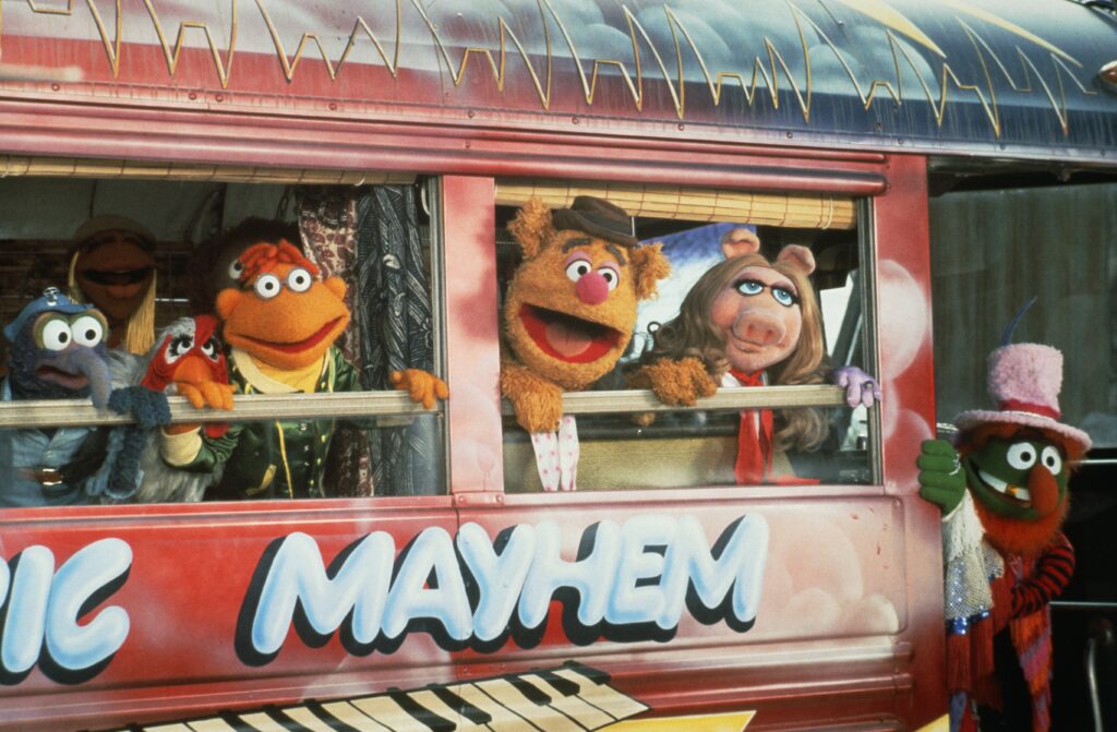 L-R: Gonzo, Janice, Rowlf the Dog, Camilla the Chicken, Scooter, Fozzie Bear, Miss Piggy, and Dr. Teeth in The Muppet Movie.