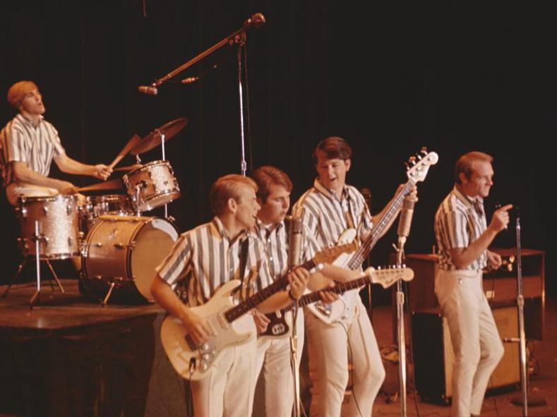 Rock and roll band The Beach Boys perform onstage in circa 1964 in California. (L-R) Dennis Wilson, Al Jardine, Carl Wilson, Brian Wilson, Mike Love.