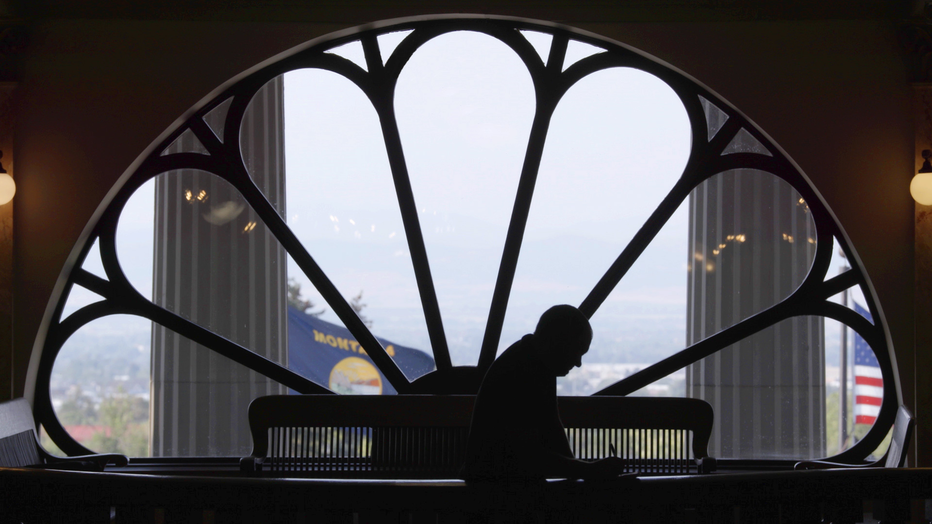 John S. Adams silhouetted in the Montana Capitol building, from DARK MONEY, a PBS Distribution release.