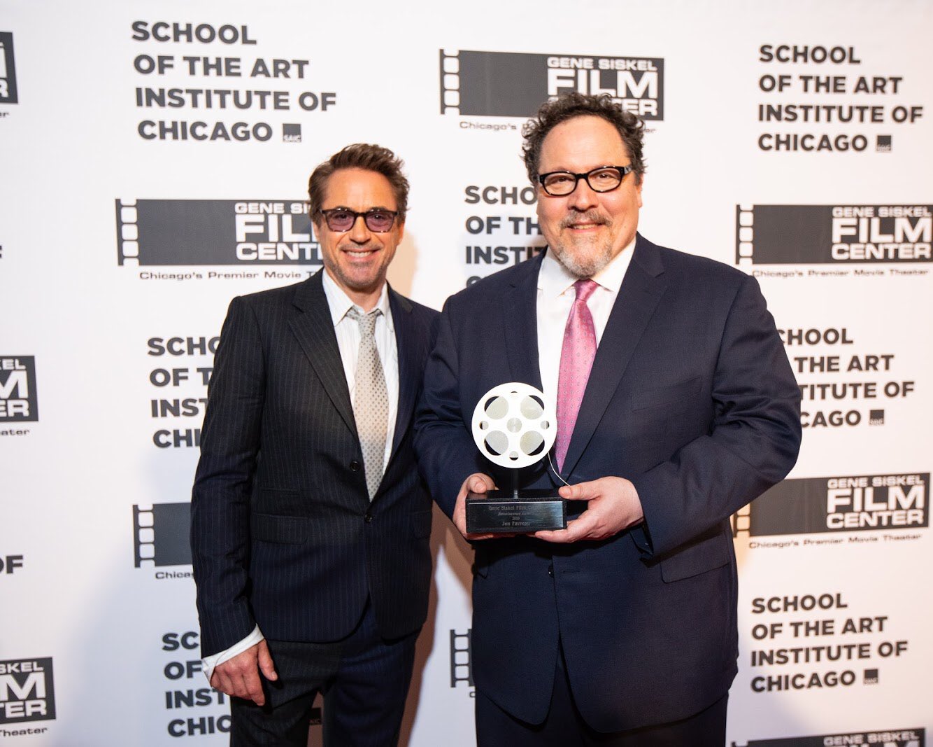 Robert Downey Jr. and Jon Favreau with the Gene Siskel Film Center Renaissance Award.