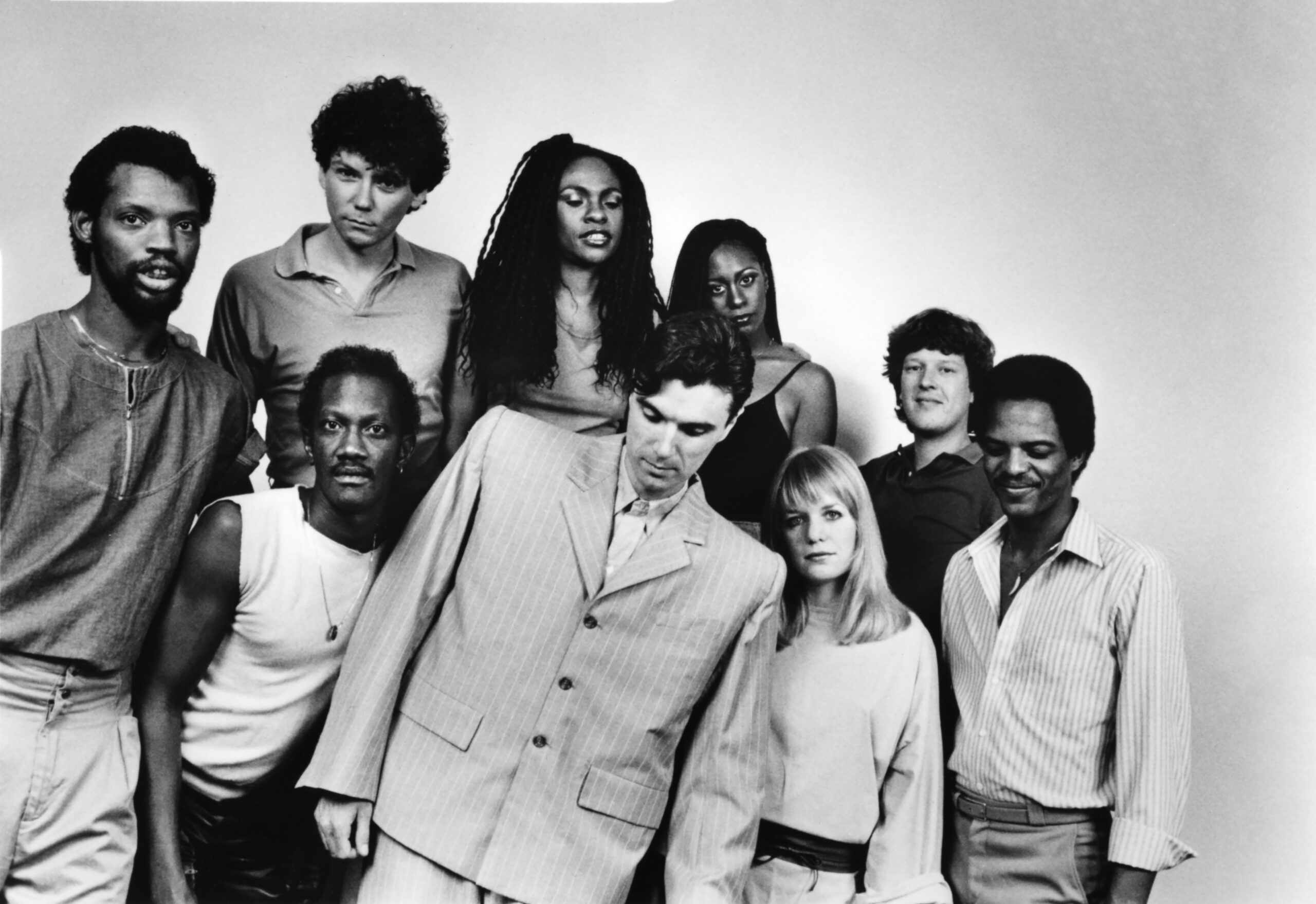 L-R Steve Scales, Bernie Worrell, Jerry Harrison, Ednah Holt, David Byrne, Lynn Mabry, Tina Wemouth, Chris Frantz and Alex Weir pose for a portrait in 1984