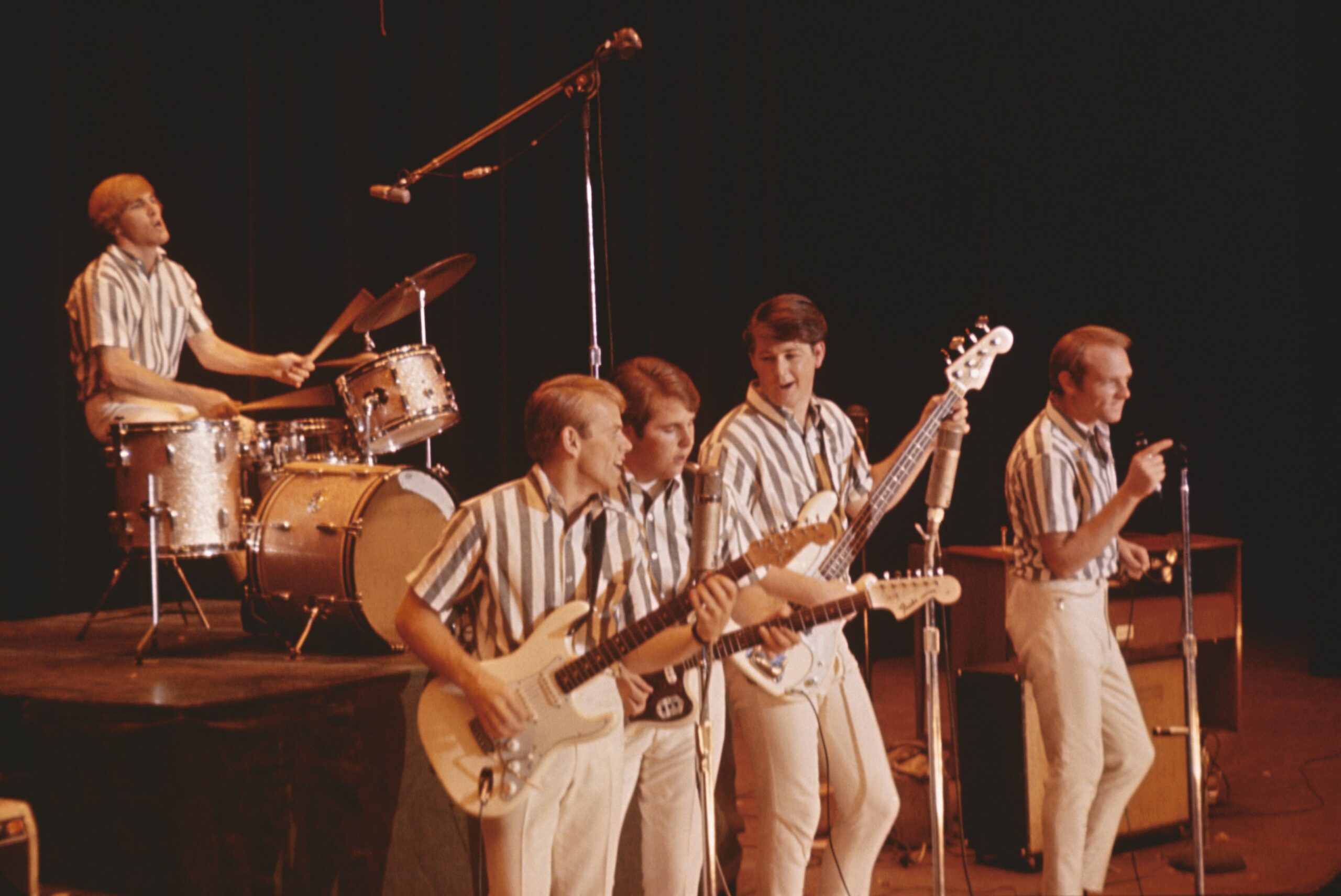 Rock and roll band The Beach Boys perform onstage in circa 1964 in California. (L-R) Dennis Wilson, Al Jardine, Carl Wilson, Brian Wilson, Mike Love.