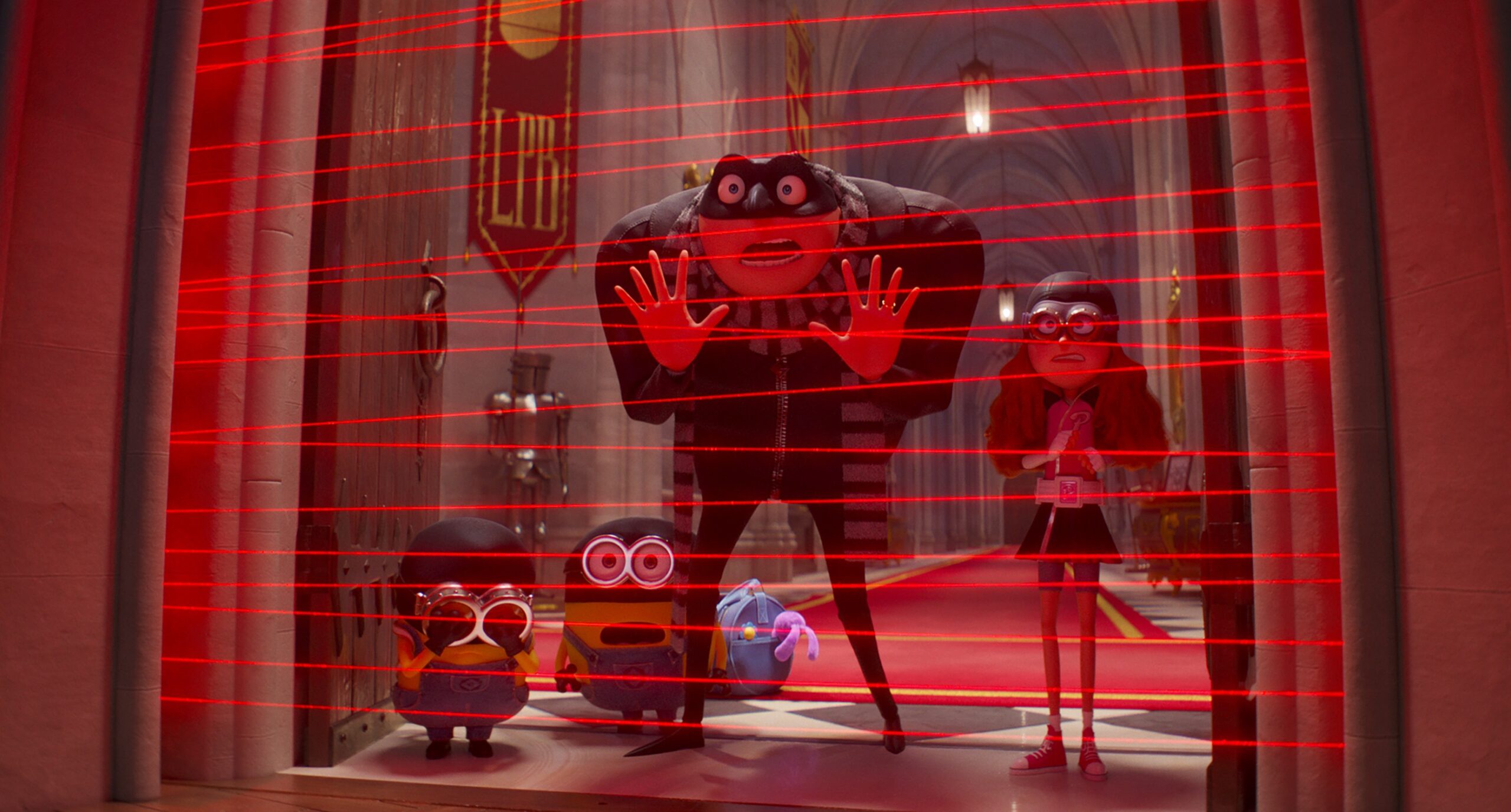 L-R: Minions (Pierre Coffin), Gru (Steve Carell) and Poppy Prescott (Joey King) in Despicable Me 4, directed by Chris Renaud.
