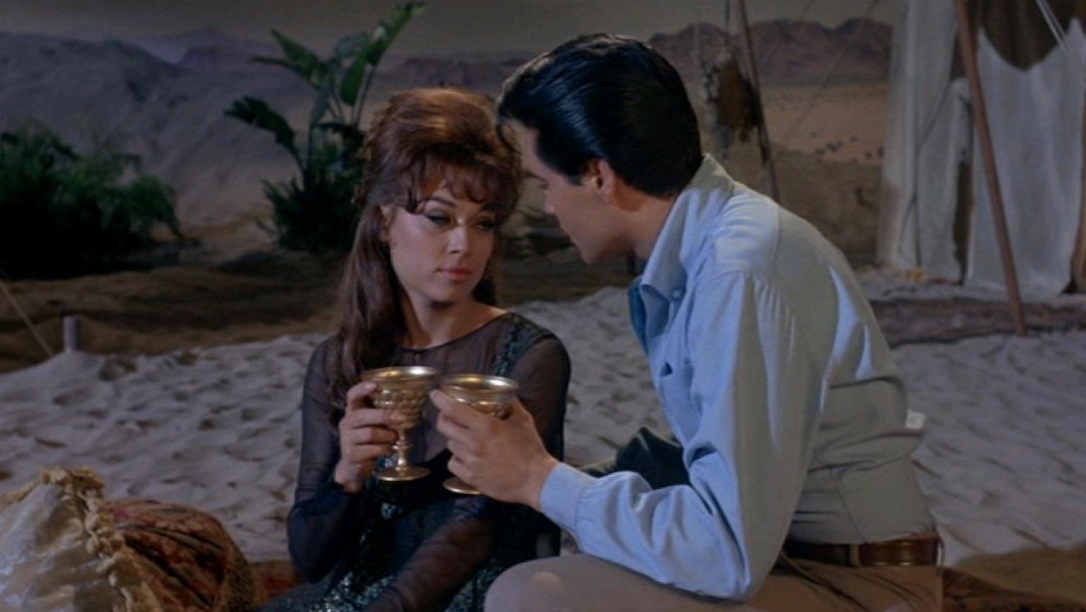 L-R: Mary Ann Mobley and Elvis Presley in Harum Scarum.