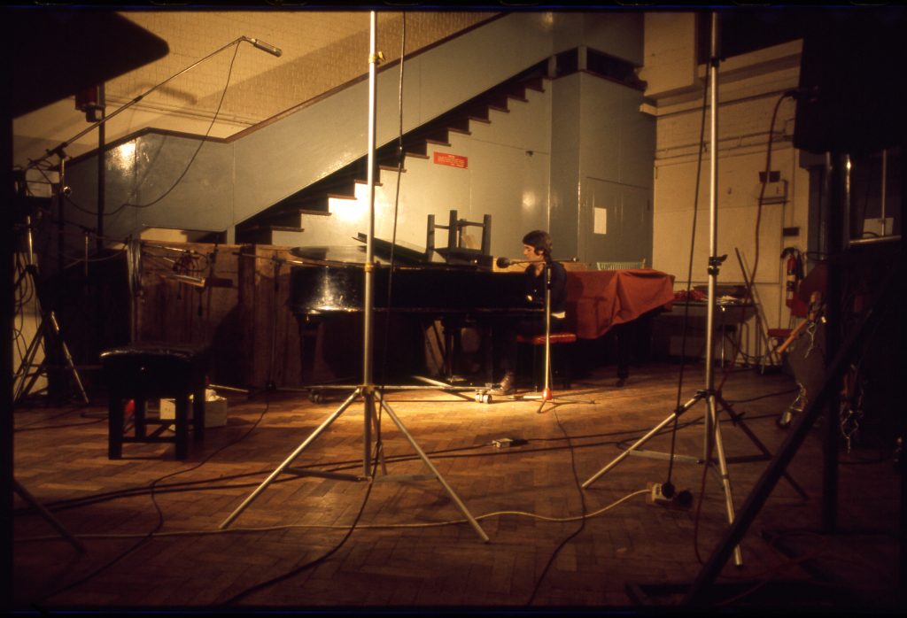 Paul McCartney playing piano in One Hand Clapping.