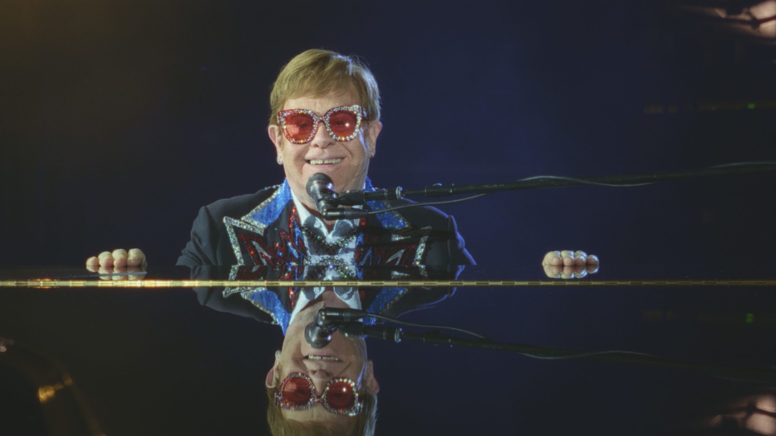 Elton takes a moment to enjoy his final concert tour performance at Dodger Stadium on November 20, 2022 in a still from Elton John: Never Too Late.