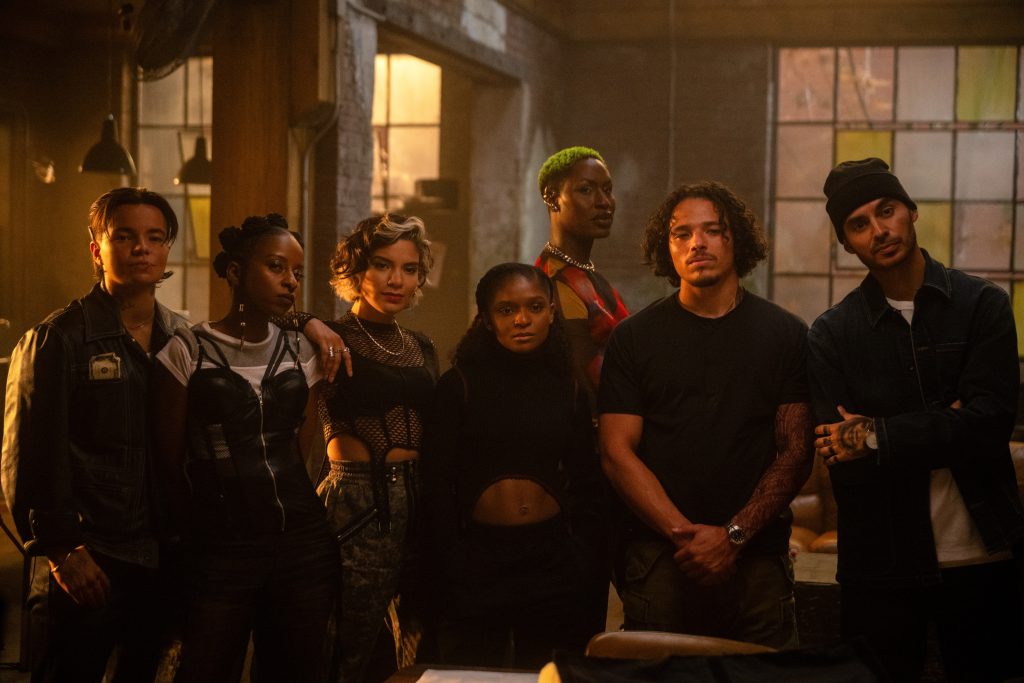 L-R: Zoe Terakes, Sonia Denis, Shakira Barrera, Dominique Thorne, Shea Couleé, Anthony Ramos, and Manny Montana in Marvel Television's IRONHEART, exclusively on Disney+.