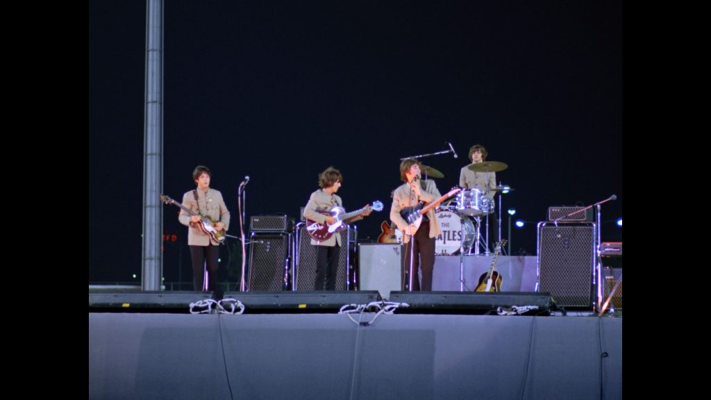 The Beatles at Shea Stadium in Flushing Meadow, New York 15th August 1965. They performed to a massive audience of 55,600 a record for any concert at the time.