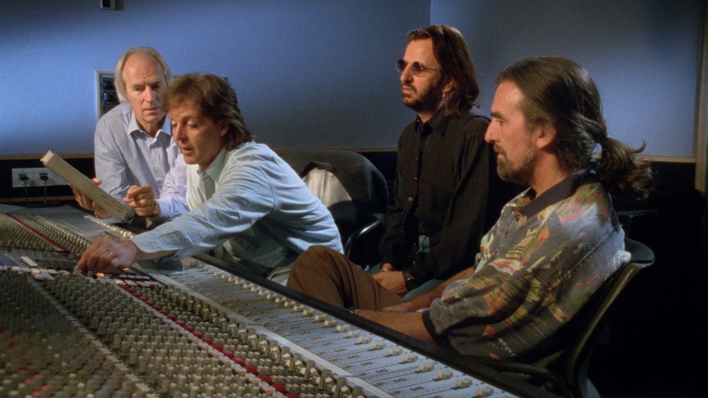 A still from The Beatles Anthology: George Martin, Paul, Ringo and George listen back to some of the multi-track tapes of the Beatles recordings at Abbey Road Studios in 1995.