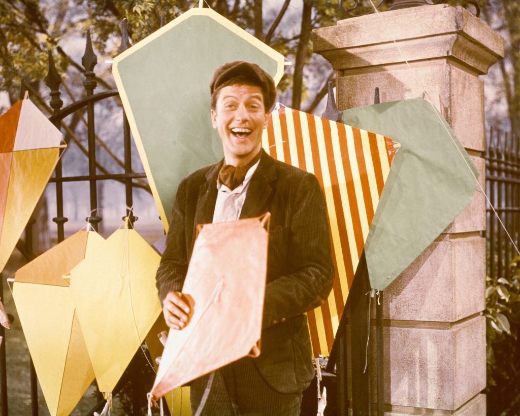 Dick Van Dyke with a variety of kites in a publicity still for the film, 'Mary Poppins', USA, 1964.