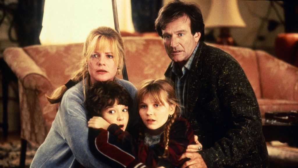 L-R: Bonnie Hunt, Bradley Pierce, Kirsten Dunst, and Robin Williams in Jumanji.