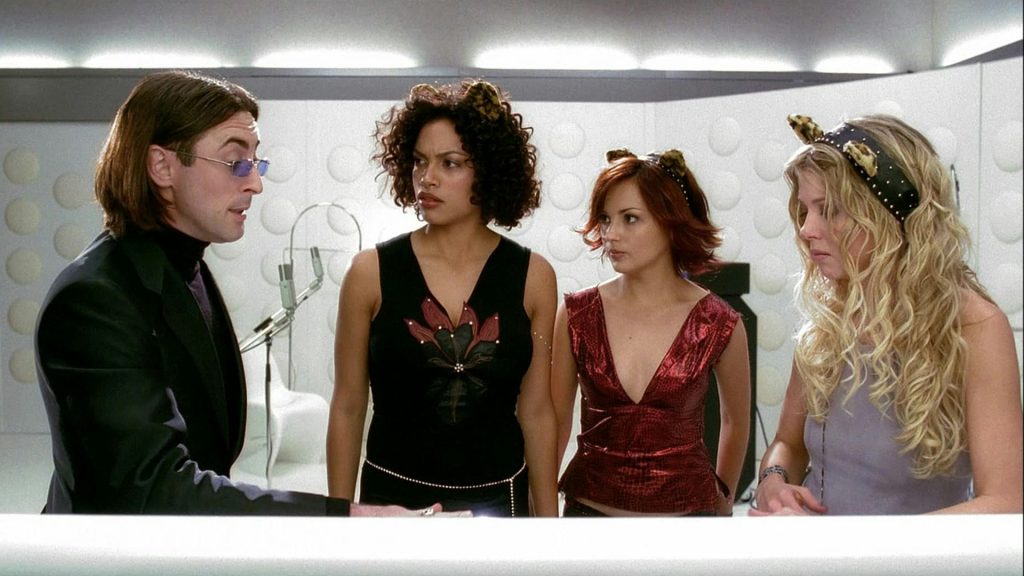 Alan Cumming, Rosario Dawson, Rachel Leigh Cook, and Tara Reid in Josie and the Pussycats.